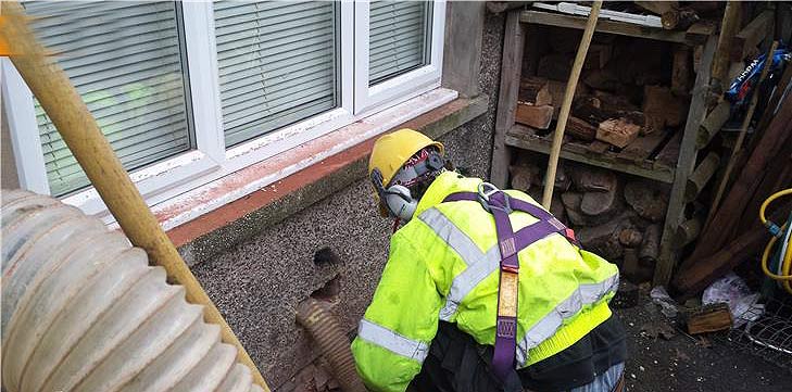 Wall having defective insulation material removed Wall having defective insulation material removed